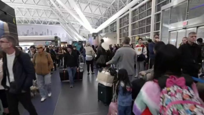 Travelers frustrated by long security lines may not see immediate relief, even as Transportation Security Administration officers begin receiving pay again on Monday after working without wages for more than a month during the partial government shutdown.
President Donald Trump signed an executive order Thursday directing federal officials to ensure that TSA workers are paid despite the shutdown, breaking a more than 40-day stretch in which officers went without salaries.
But the move is unlikely to bring instant relief at airport checkpoints, according to former TSA Administrator John S. Pistole.
“It’s a temporary fix,” he told NBC News.
The more pertinent question, he said, is how many workers actually return to their posts now that paychecks are set to resume Monday.
More than 500 officers have quit during the shutdown, according to the Department of Homeland Security, while thousands more have called out because they can’t afford basic expenses.
TSA callout rates reached a high of 12.35% of the workforce on Friday, accounting for more than 3,560 employees, a DHS spokesperson said Saturday. The department added that at Trump’s direction and under Homeland Security Secretary Markwayne Mullin, TSA has “immediately begun the process of paying its workforce” and that officers “should begin seeing paychecks as early as Monday, March 30.”
Those shortages have forced travelers to contend with missed and canceled flights, long security lines and growing uncertainty around air travel.
If most officers report back beginning Monday and airports are able to restore staffing, wait times could start to ease within several days to a couple of weeks, Pistole said.
“It really depends on that asterisk of how many people show up,” he said.
Some workers who left may already have other jobs lined up, raising questions about whether some will return at all.
“How many of them come back after they get this paycheck? Or maybe they already have another full-time job lined up, they’re just waiting to inform TSA after they get their check on Monday,” Pistole said. “So there are a number of variables there.”
Pistole said the uncertainty, coupled with TSA’s typical annual attrition rate of about 7%, could mean delays will continue even after pay resumes.
Until then, some travelers may want to consider alternatives such as driving, rail or bus.
“I think many will and are looking at those options to say, ‘Is that more reliable? Because the last thing I want to do is get to Bush International Airport in Houston and have a four-hour wait,’” Pistole said.
